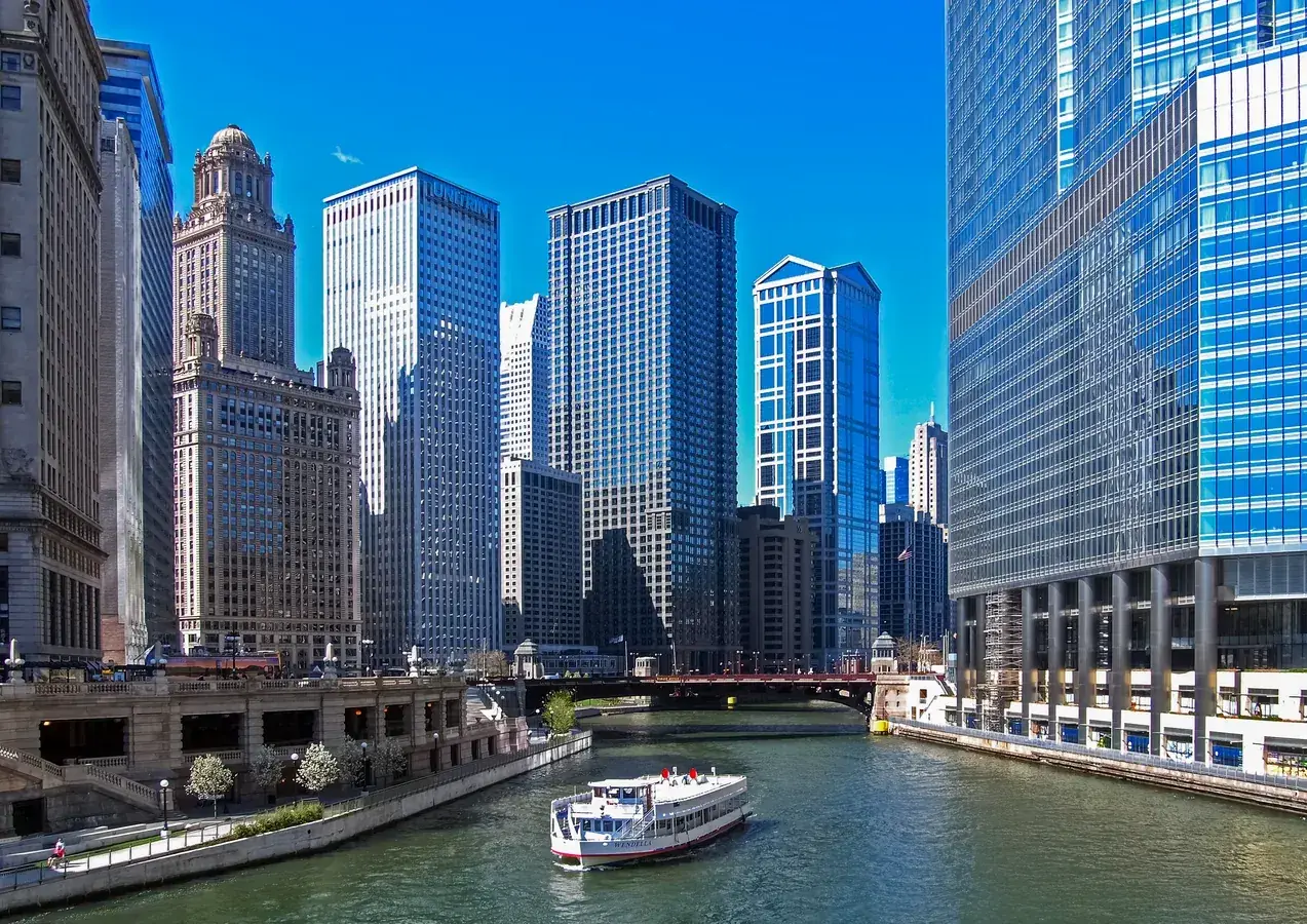 A Chicago River tour boat passes in front of Trump Tower — Chicago, IL