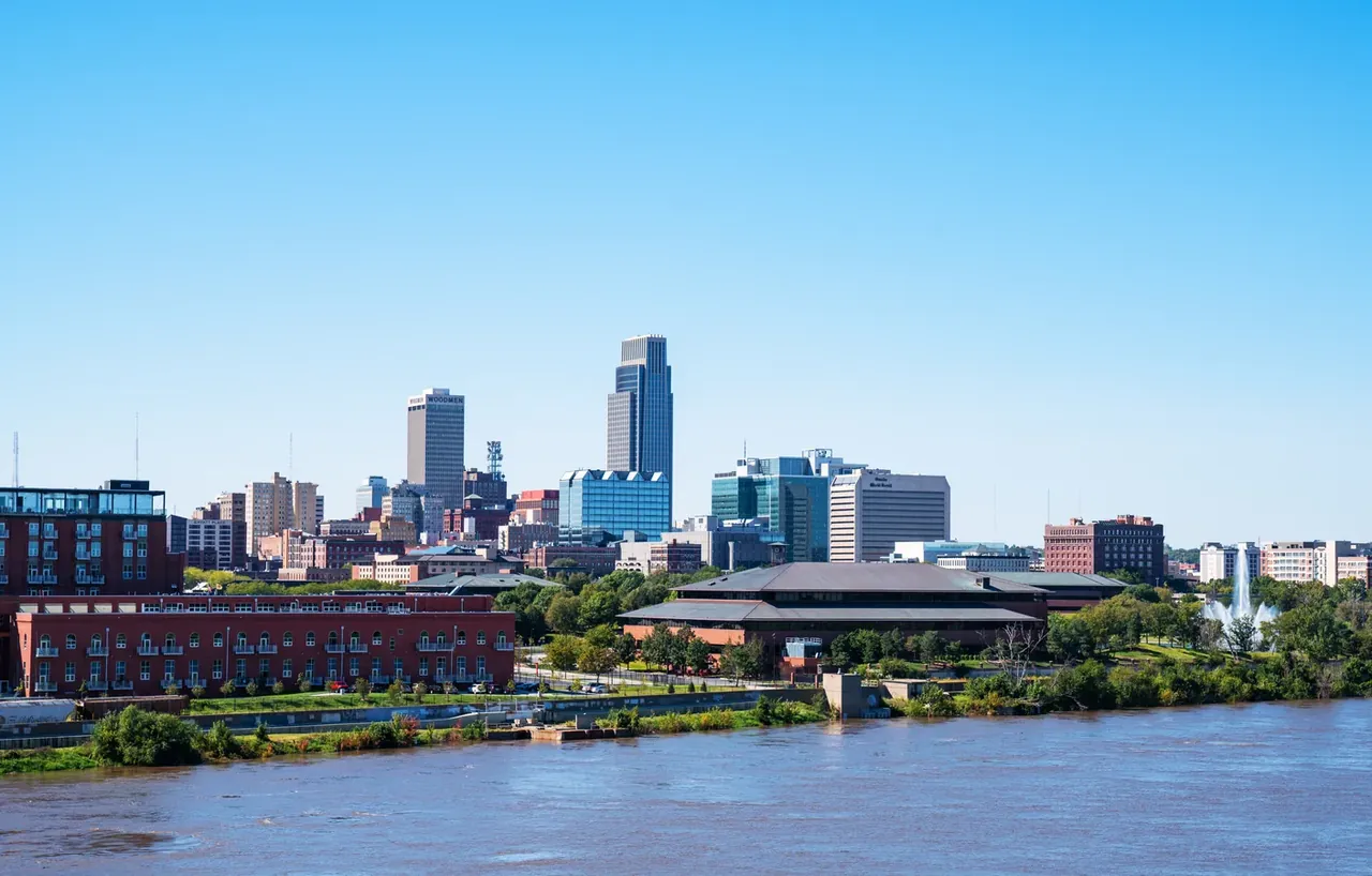 The downtown skyline in Omaha, Nebraska, as seen from across the Missouri River in Council Bluffs, Iowa.

/sim — Omaha, NE